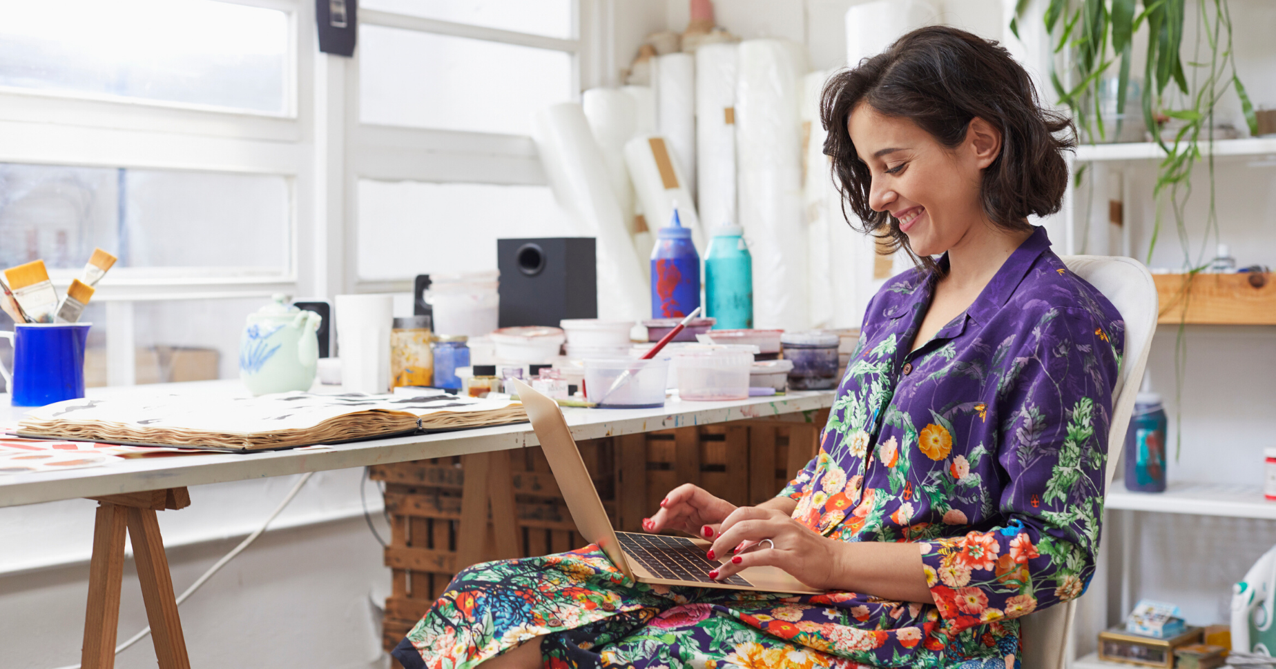 Woman on a laptop applying for a small business loan.