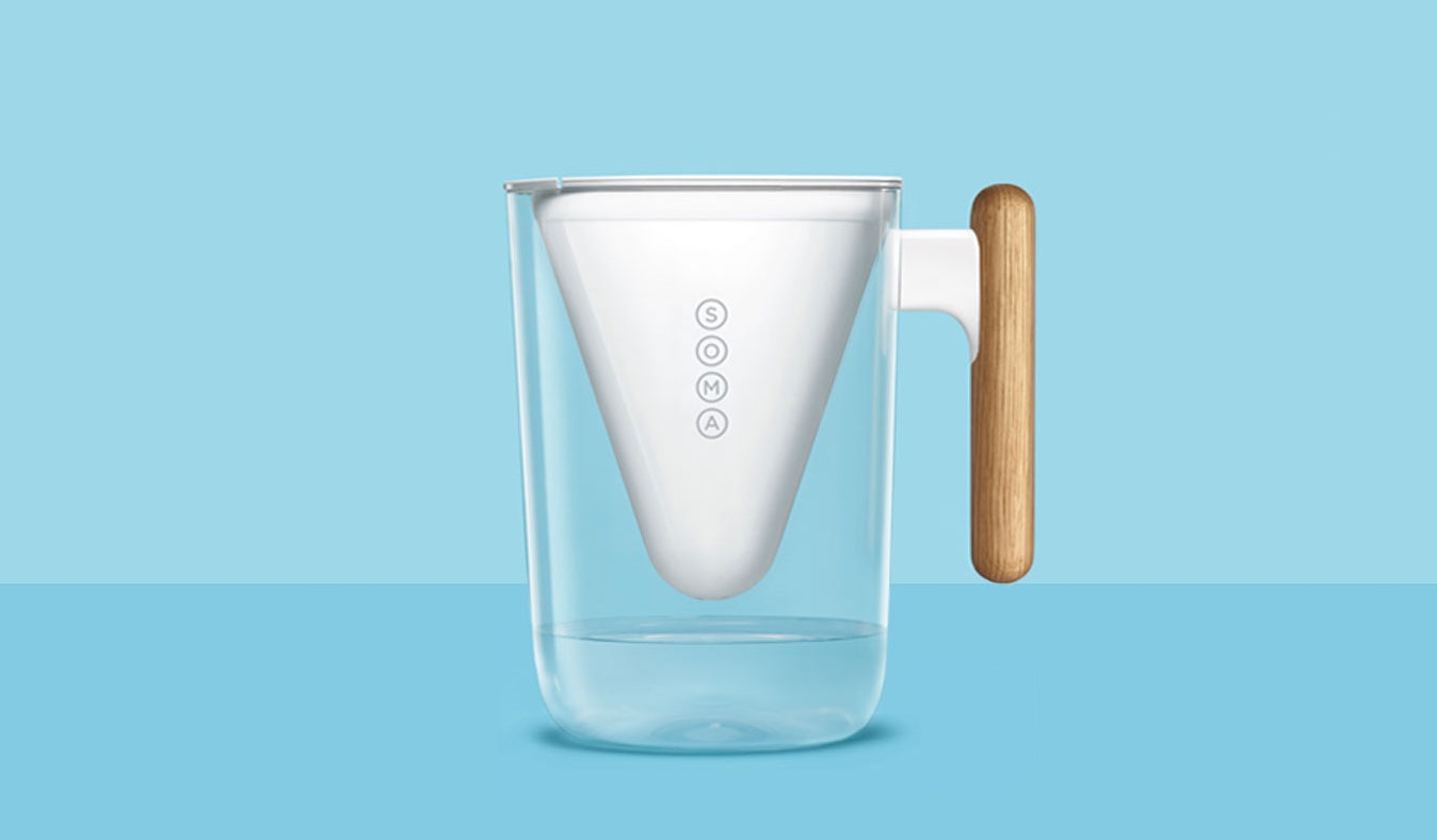 Soma water pitcher against a light blue background