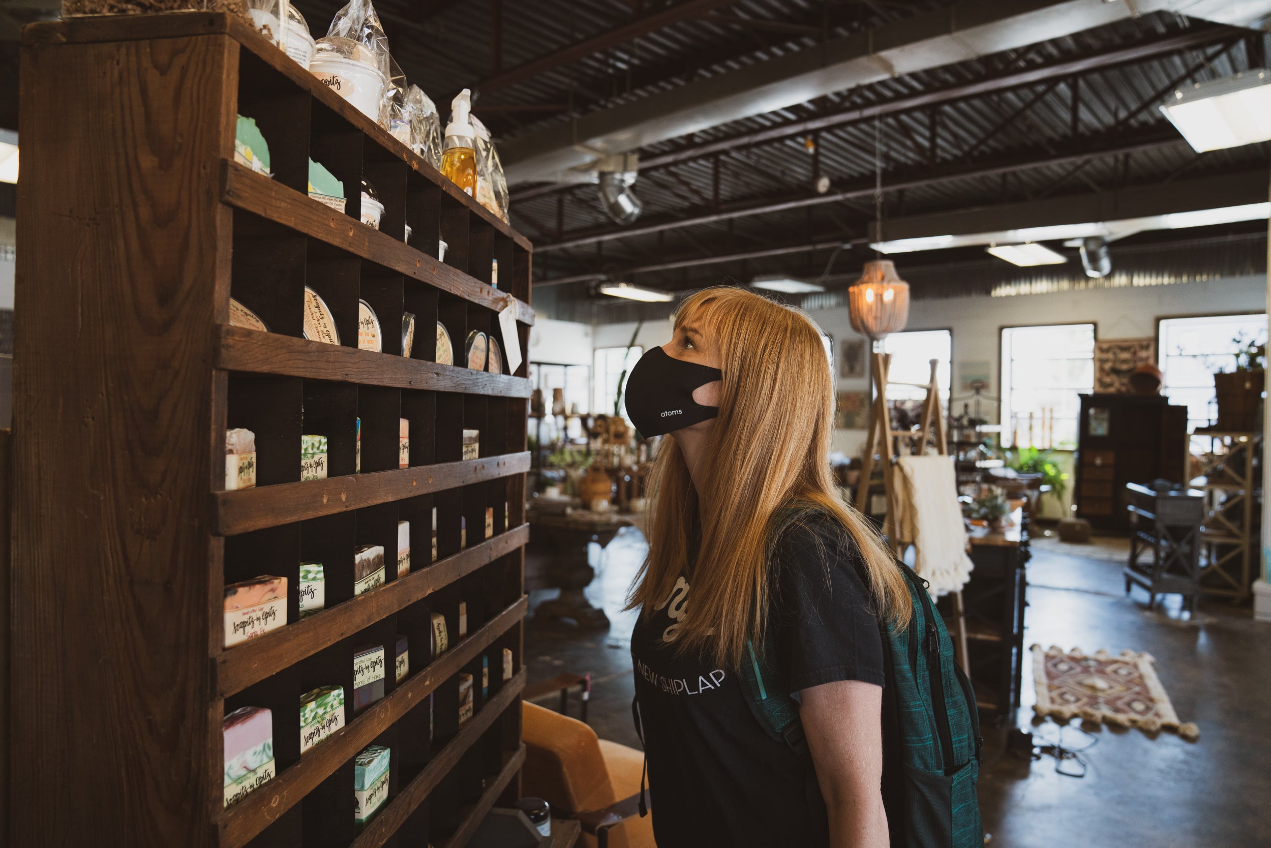 Person shops in a retail store wearing a mask