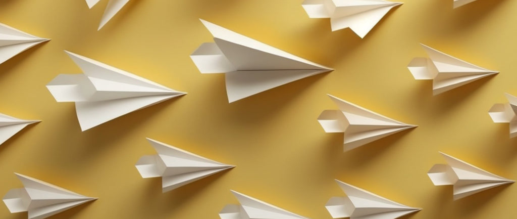 A group of paper airplanes bunched together