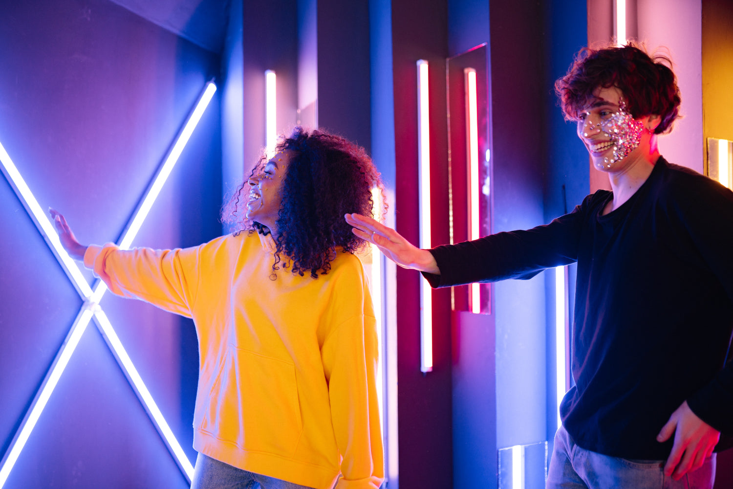 Two people explore a light exhibit