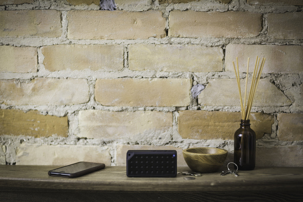 Bluetooth speaker sitting on table in living room