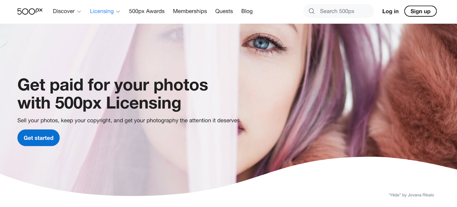 500px website with a menu of categories, a search bar, and a button to learn more about how to get paid for your photos.