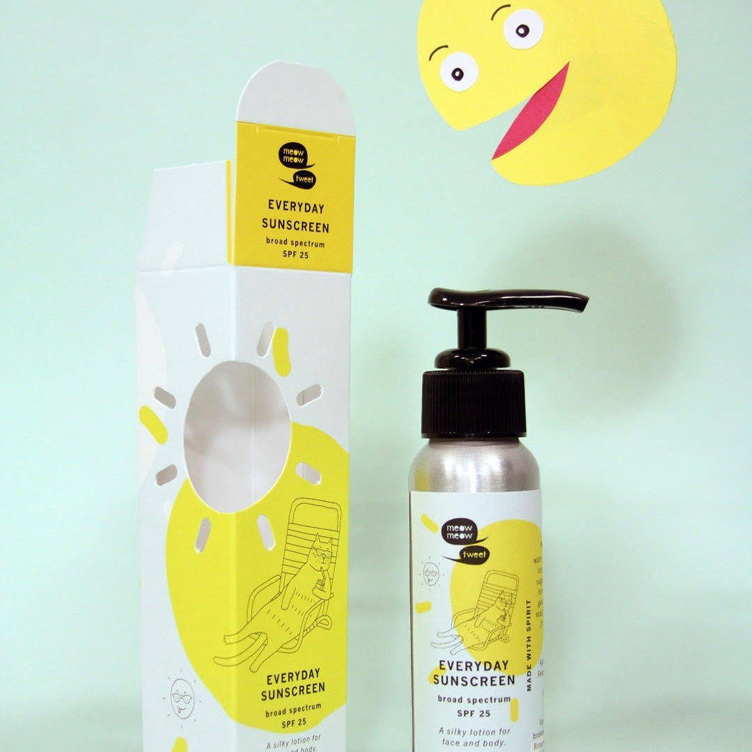 The packaging and bottle for Meow Meow Tweet's Everyday Sunscreen.