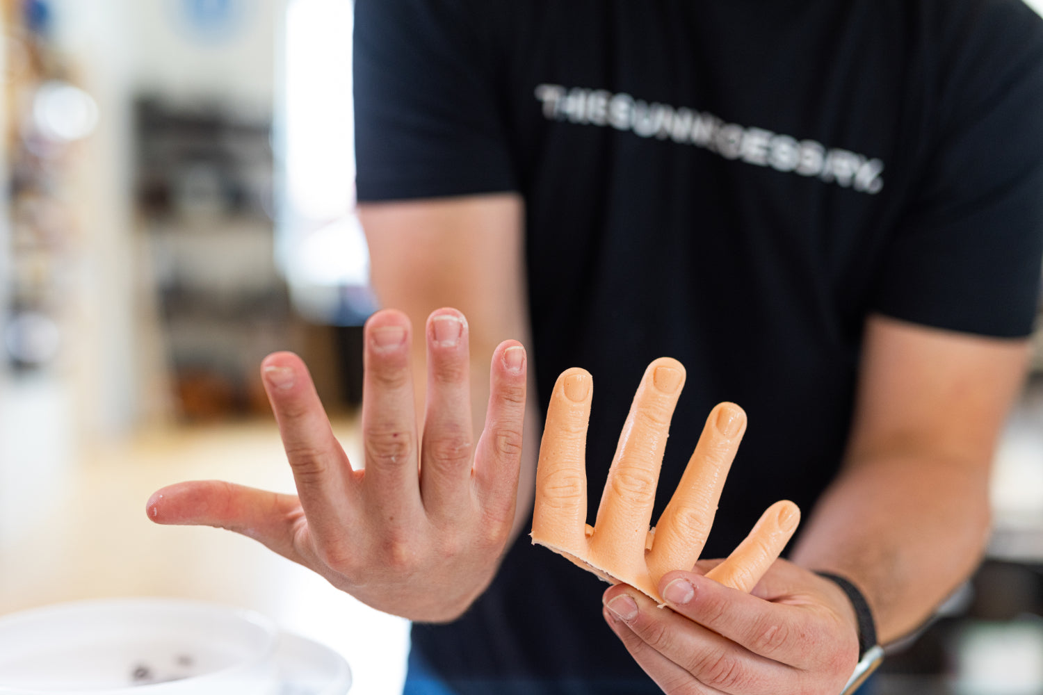 Matty Benedetto demonstrates one of his Unnecessary Inventions, a silicone hand glove