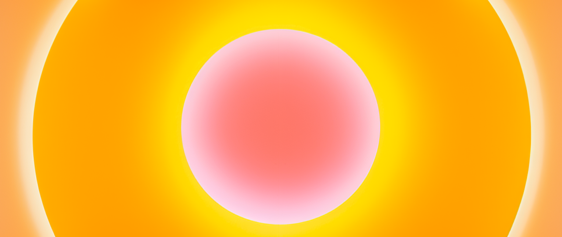 A pink ball inside yellow, white, and orange rings.