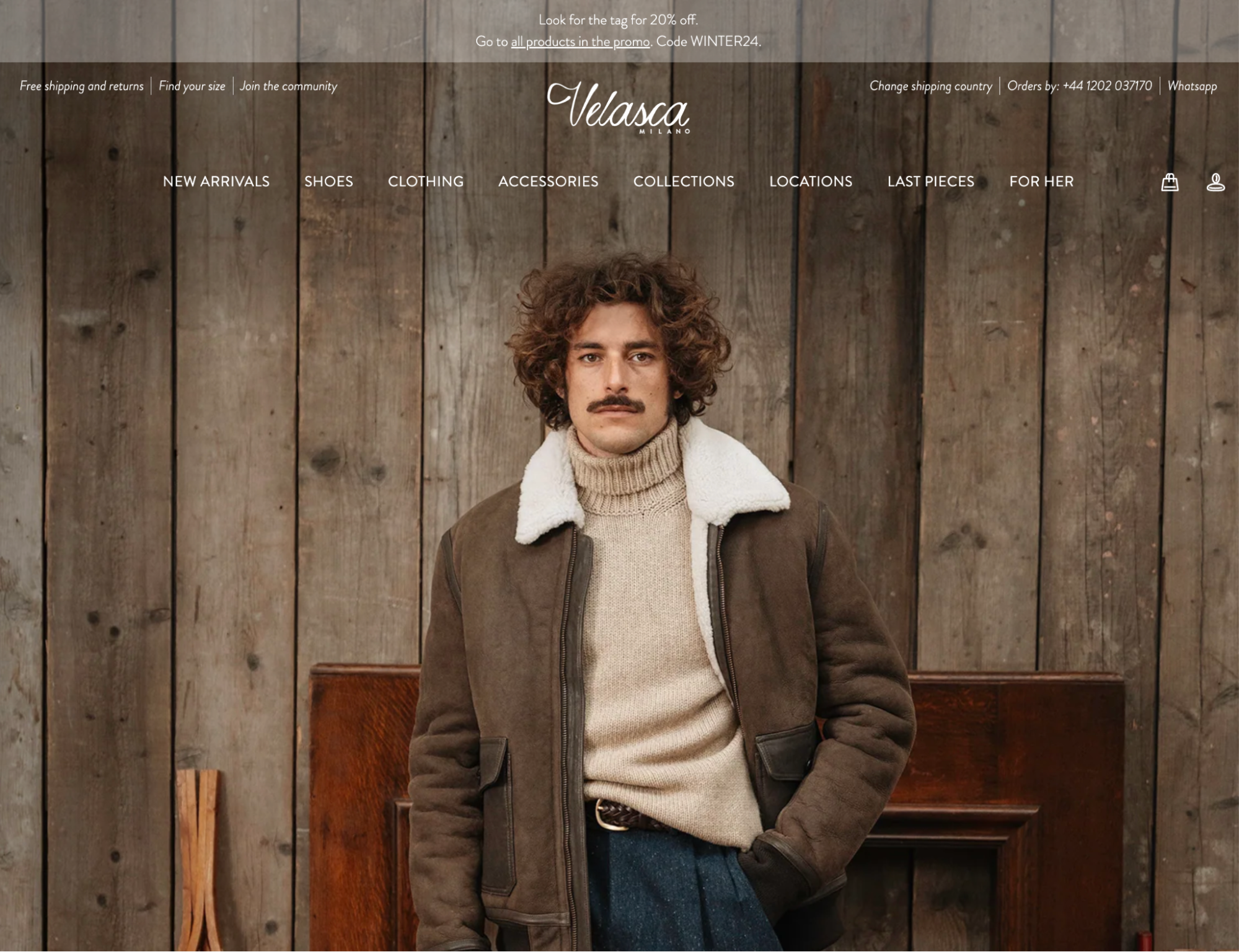 DTC brand Velasca’s ecommerce website homepage with a man wearing a turtleneck and jacket