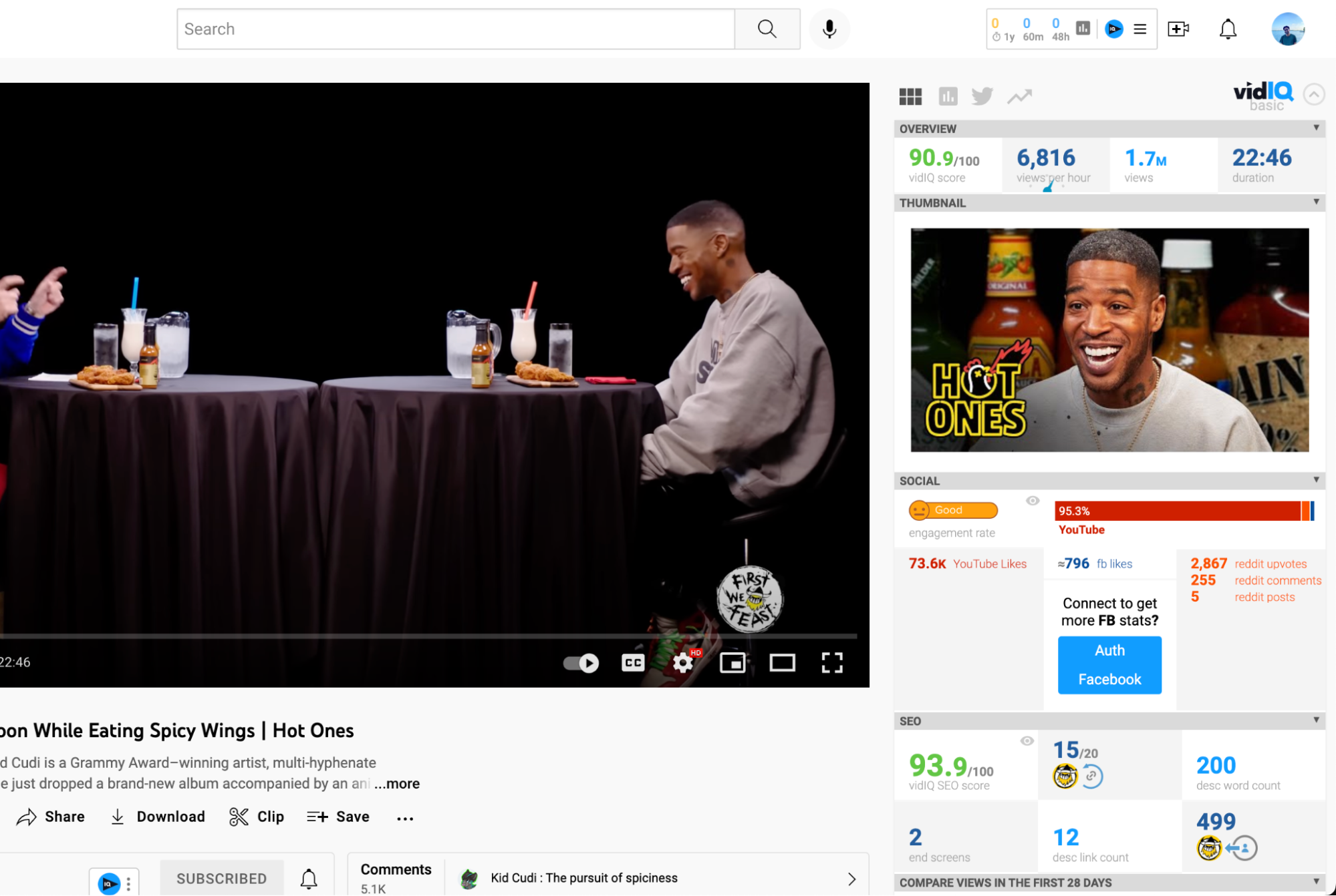 Kid Cudi laughs while eating spicy wings during a "Hot Ones" interview on YouTube.