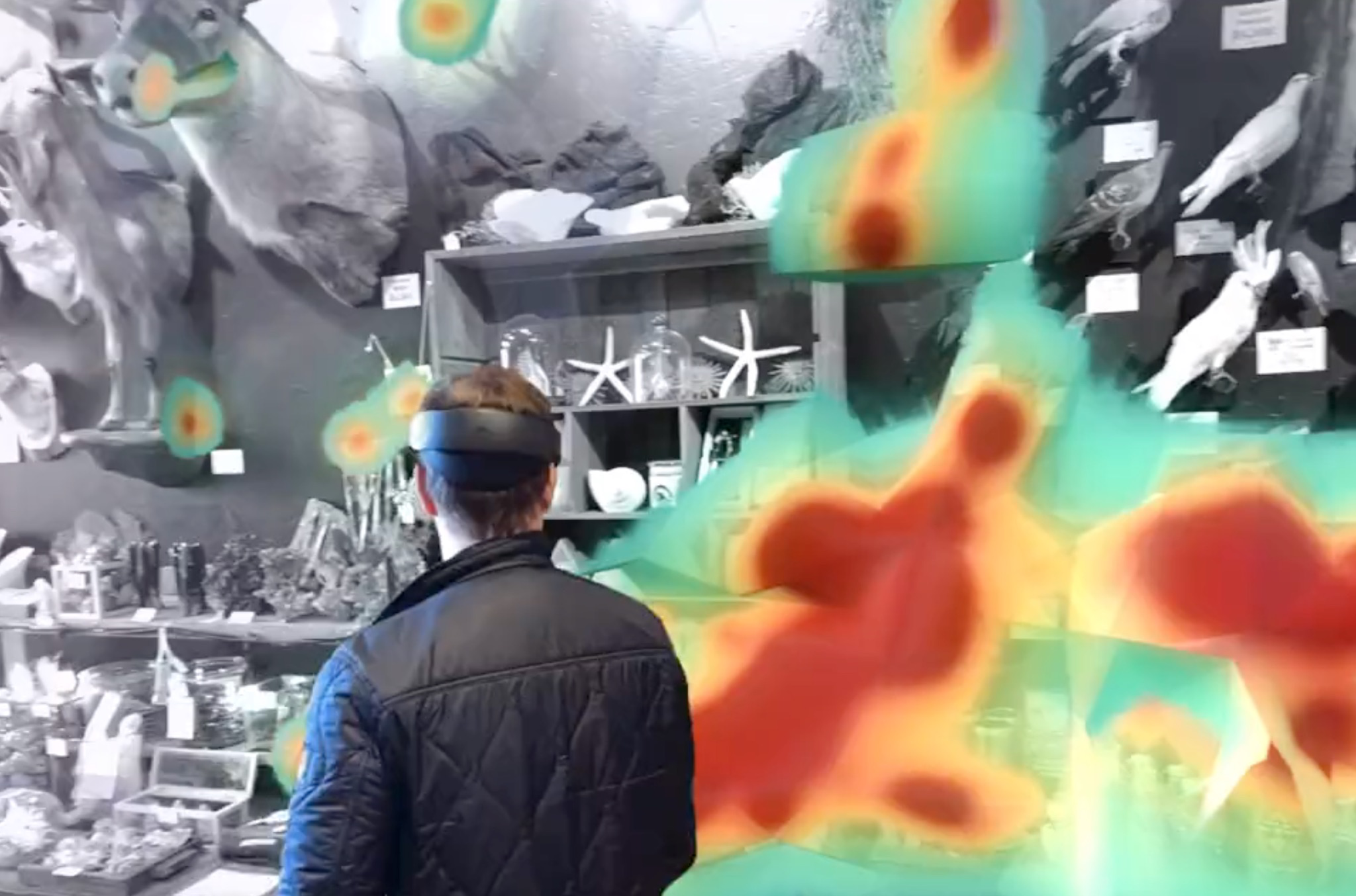 A man walking through a retail store with a VR headset, the heatmap shows what he's spending most of his time looking at