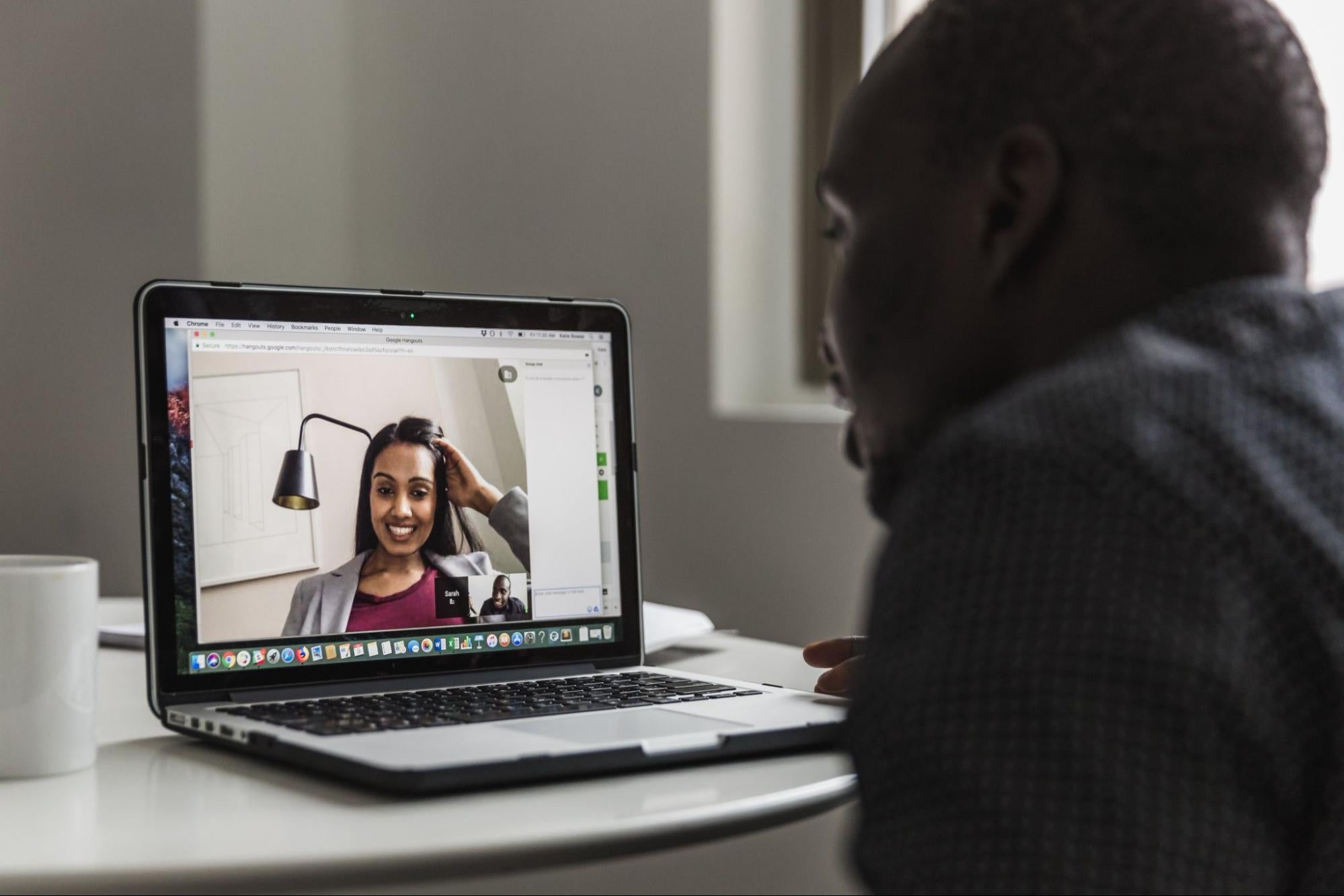 Two people having a virtual meeting.