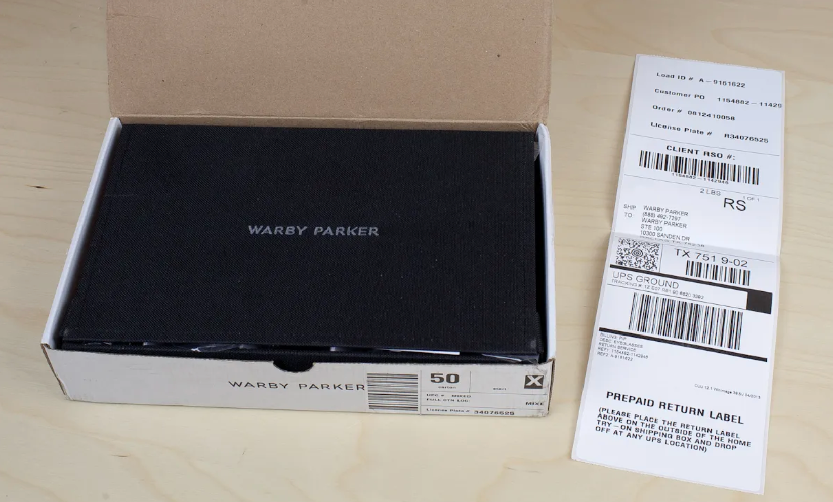 warby parker package with printed return label, ready to send off