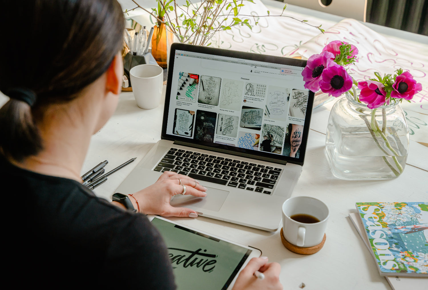 A designer browses images on a laptop