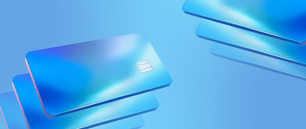 Graphic representation of business credit cards stacked against a gradient background