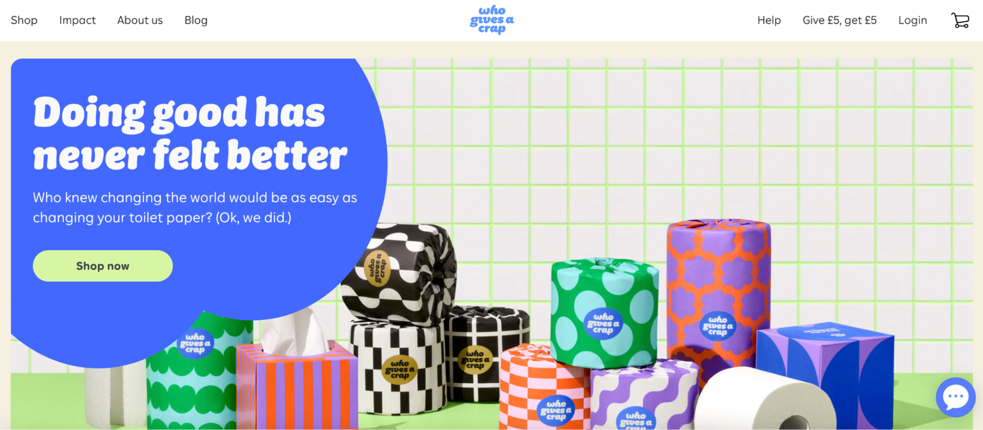 The homepage of Who Gives a Crap shows a pile of toilet rolls in bright colors against a white and bright green tiled background.