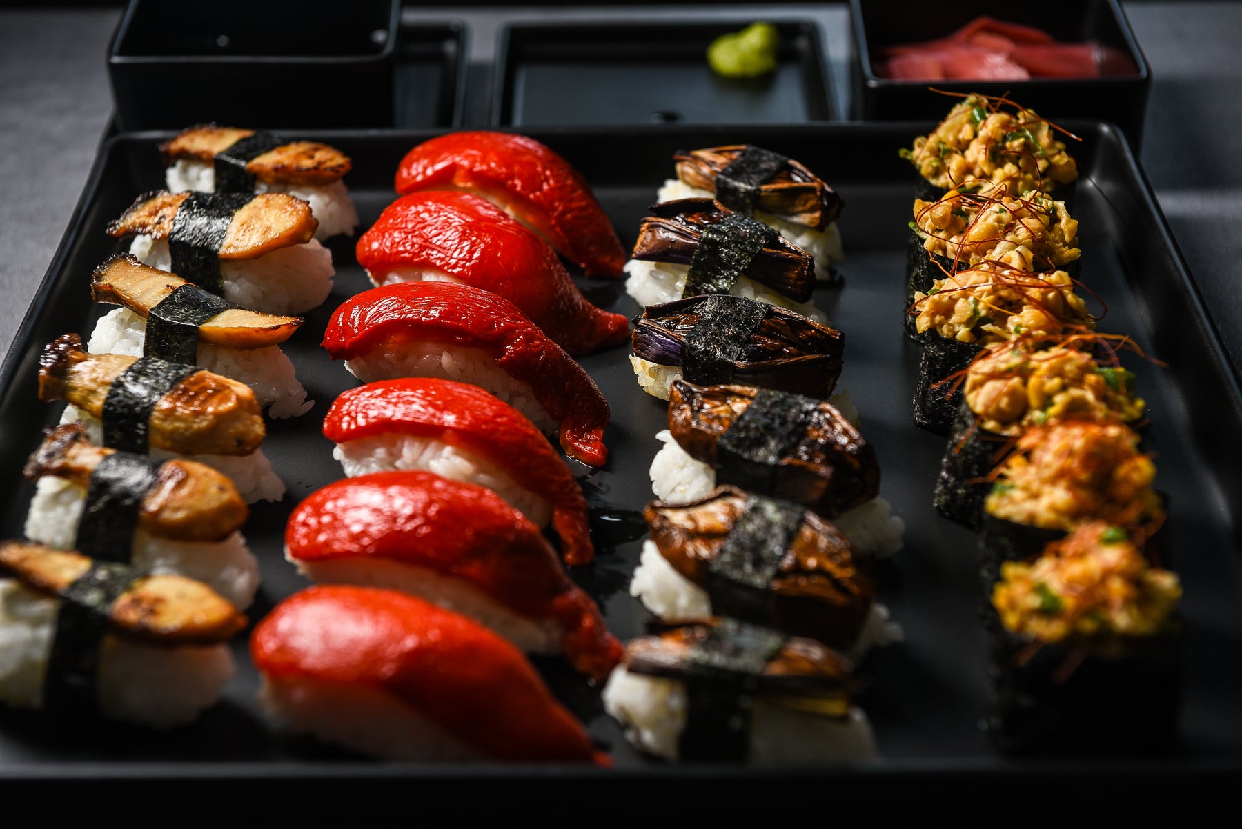 Assorted vegan sushi arranged on a platter