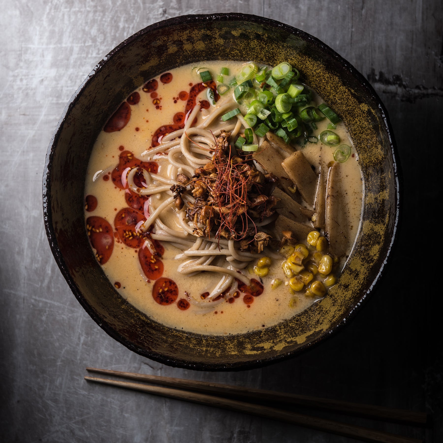 A bowl of vegan ramen, shot from above on a table