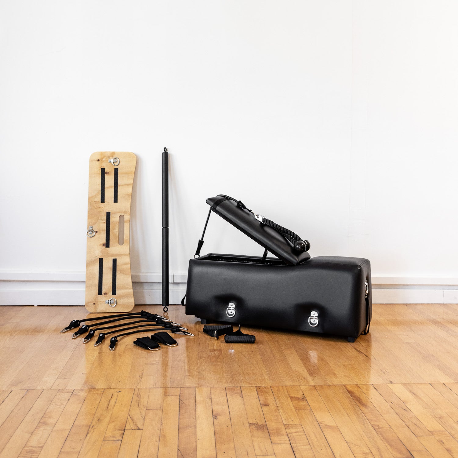  A workout bench with additional accessories in an living room setting 