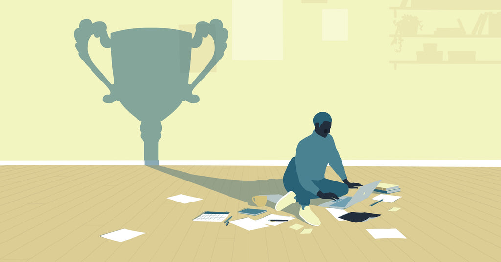 Illustration of a person sitting on the floor working on a laptop. Their shadow is in the shape of a trophy
