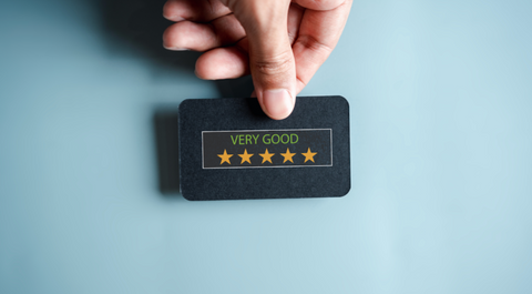 person holding a review card