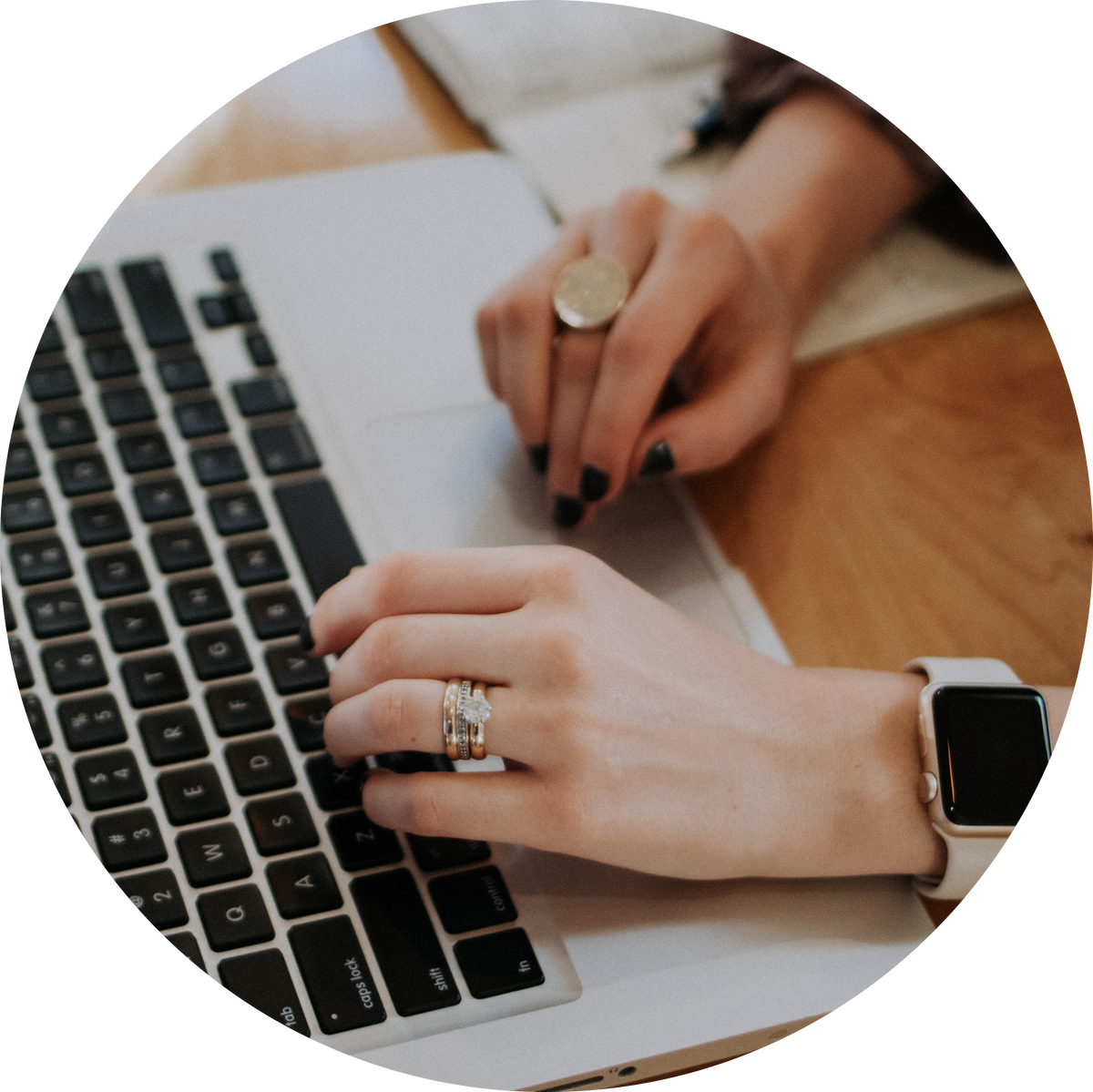 Person typing on a Macbook creating Amazon storefront content copy