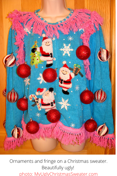 adorable blue christmas sweater with pink fringe and ornament balls