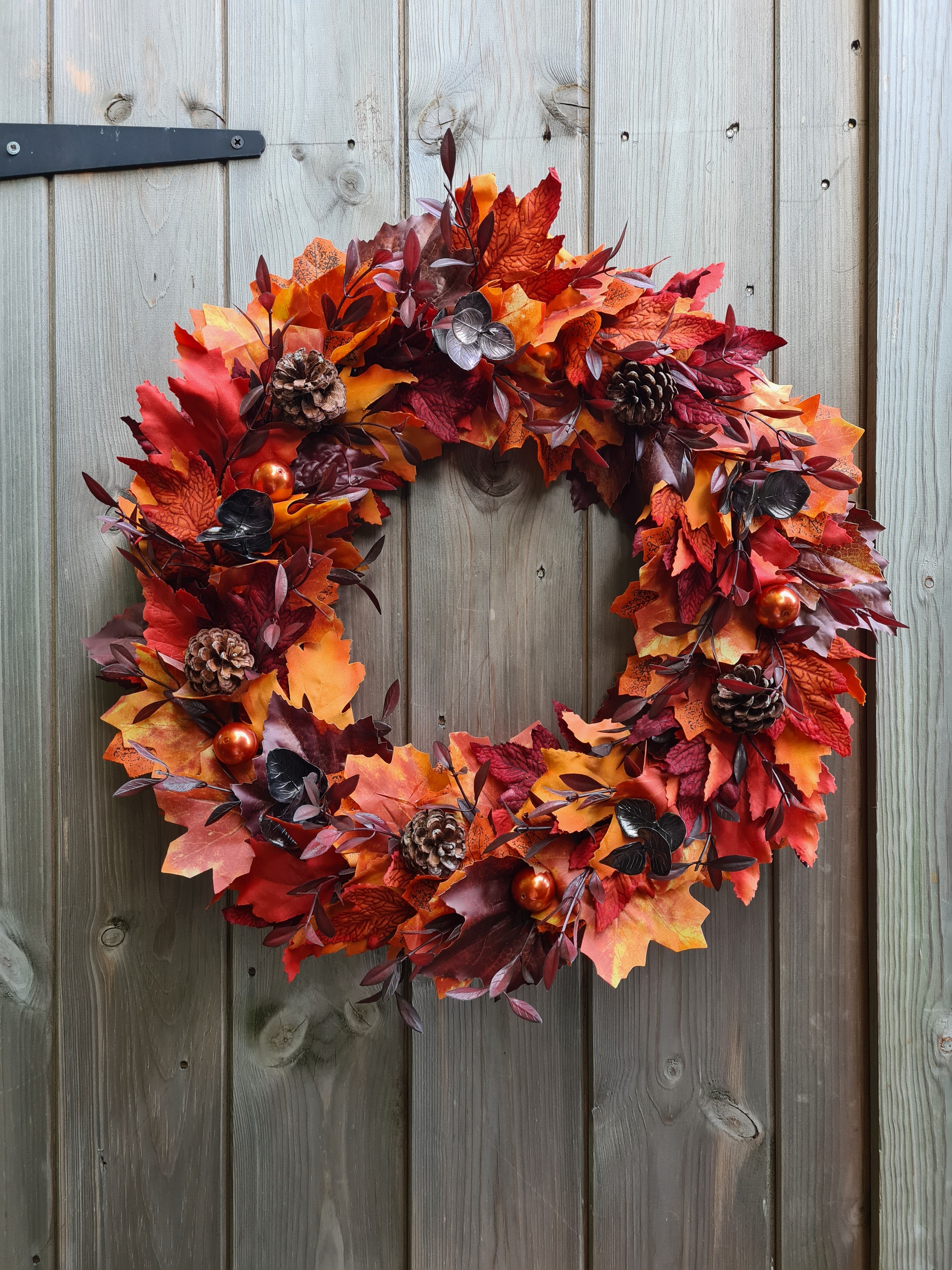 Homemade wreath autumn leaves pumpkins