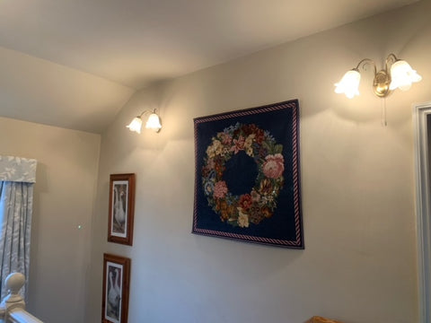 Giant Wreath needlepoint tapestry hanging on wall