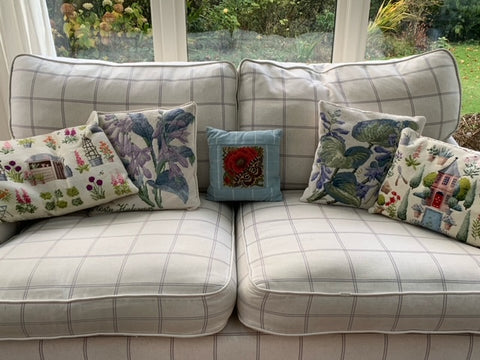 Elizabeth Bradley needlepoint cushions on couch