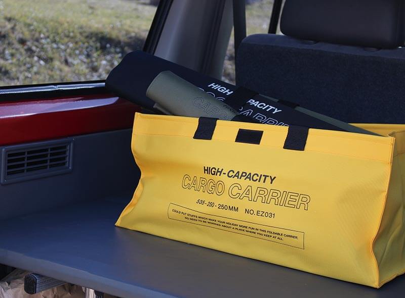 hightide cargo bag yellow in large size in a car trunk