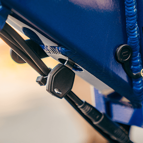 A close up of the GOTRAX F2 V2 folding electric bike's lock for a removable battery.
