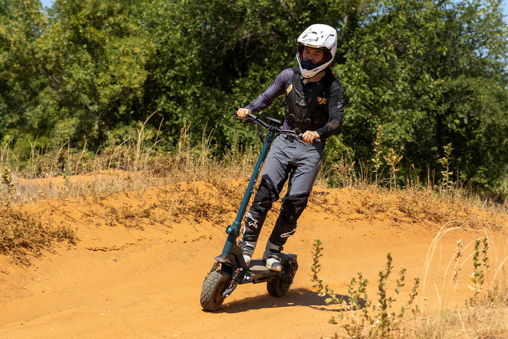 Person riding the GOTRAX GX3 Performance Electric Scooter Off-Road