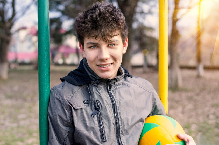 boy with braces smiling