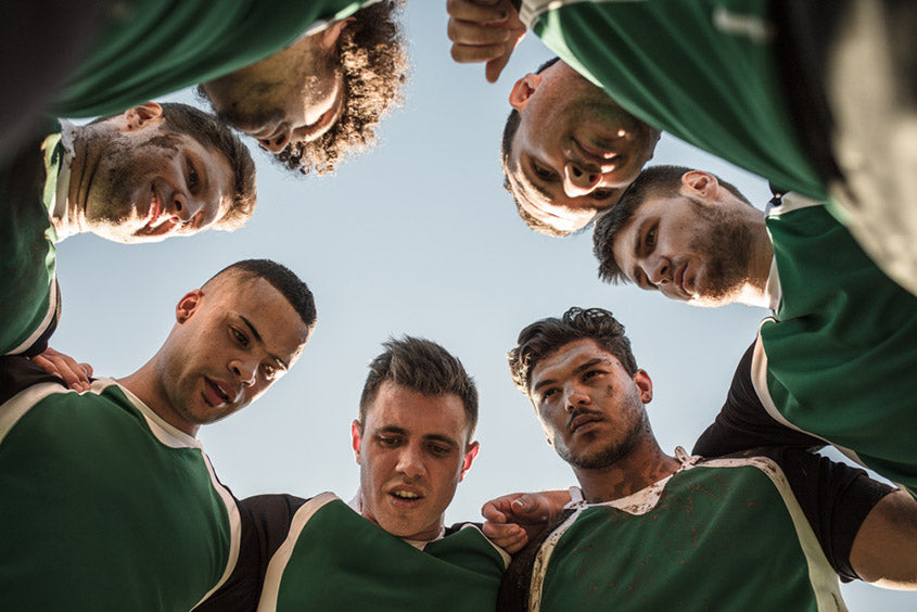 rugby players in a circle