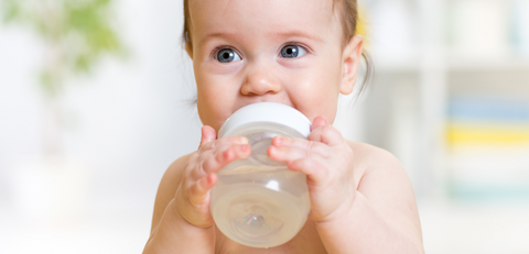 baby folding a bottle