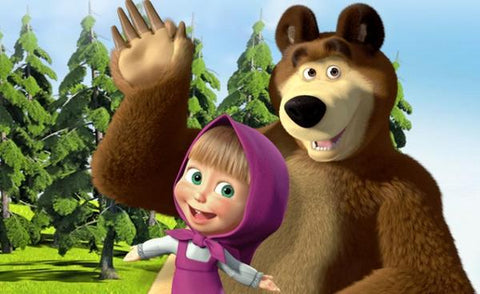 "Bear" and "Masha" from "Masha and the Bear" stand in the background of the forest