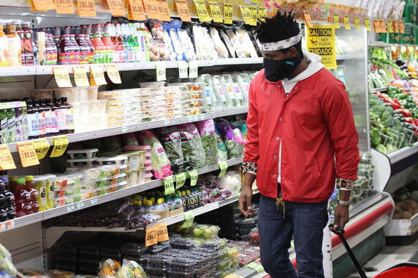 Anthony Tucker wearing Trtl Protect Mask in grocery store