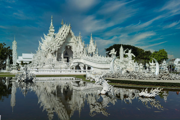 The bright white ornate temple in Chiang Rai White Temple - Wat Rong Khun by Piya Nimityongskul