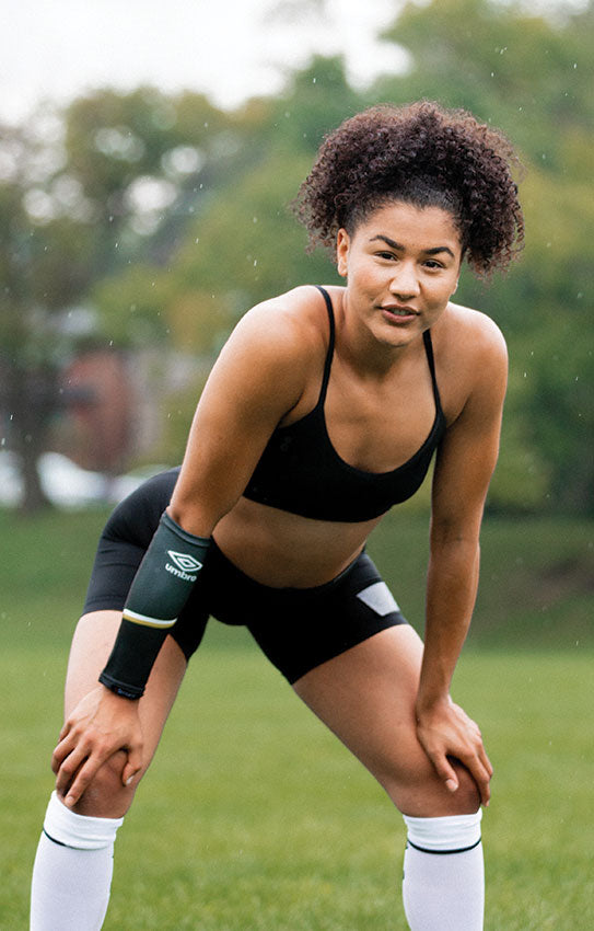 beautiful athletic african american girl in black sports bra