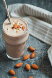 chocolate shake in a glass with almonds