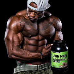 man flexing holding tub of Lean Whey protein