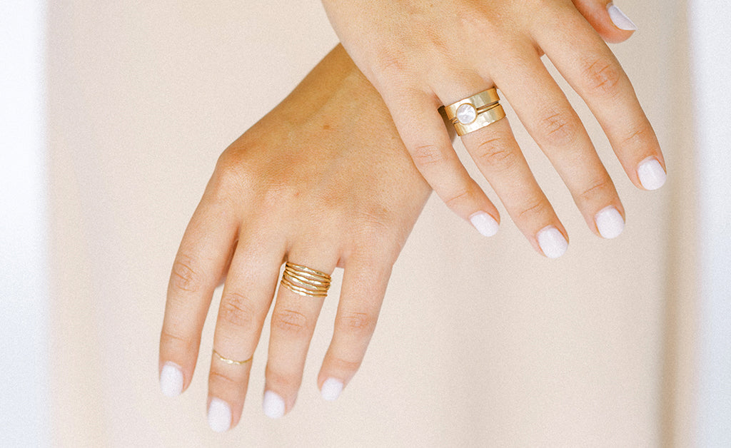 Gold stacking ring inspiration. Everyday rings. Thin gold rings made with 14k recycled gold, white topaz gemstones and mother of pearl. Modern and minimal jewelry ring styles.