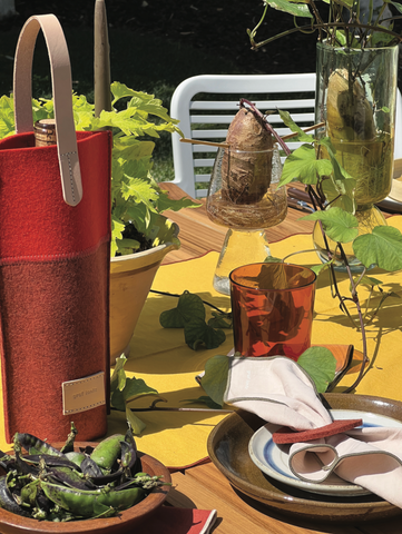 Outdoor dining set up with Merino wool felt, glasses, hemp napkins, and wine