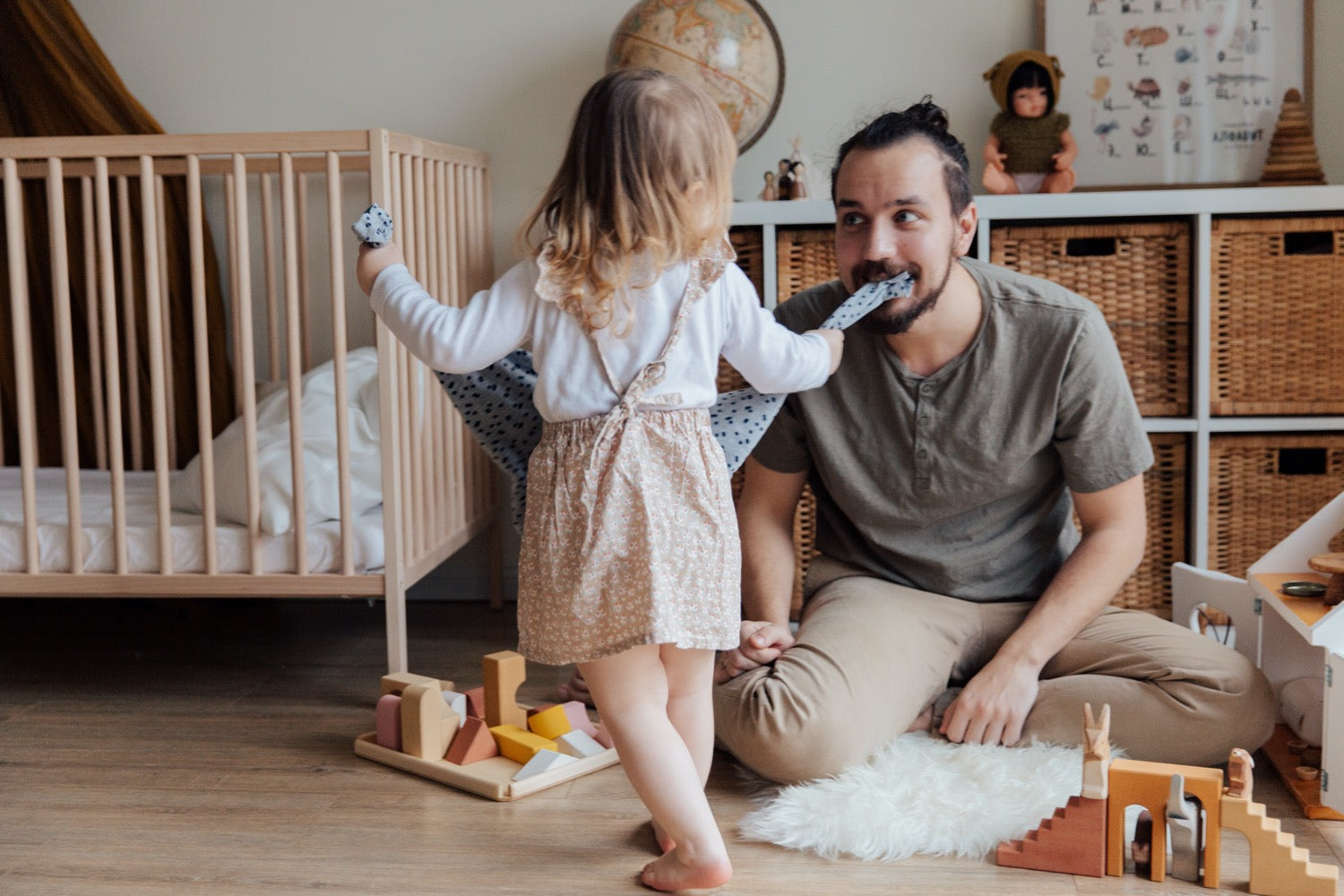 Father playing fun game with daughter