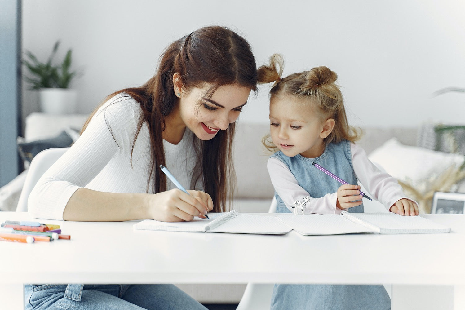 Mum and child studying together at home