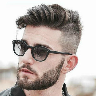 undercut hairstyle with trimmed beard