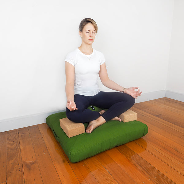 Meditation Posture with yoga block under your thigh