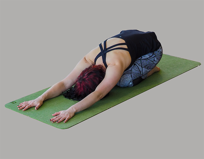 Child's Pose using Earth Fusion Yoga Mat