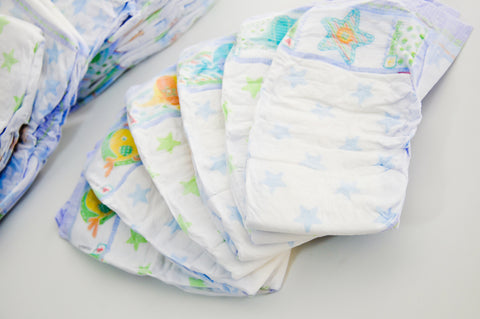 array of diapers setting on a table