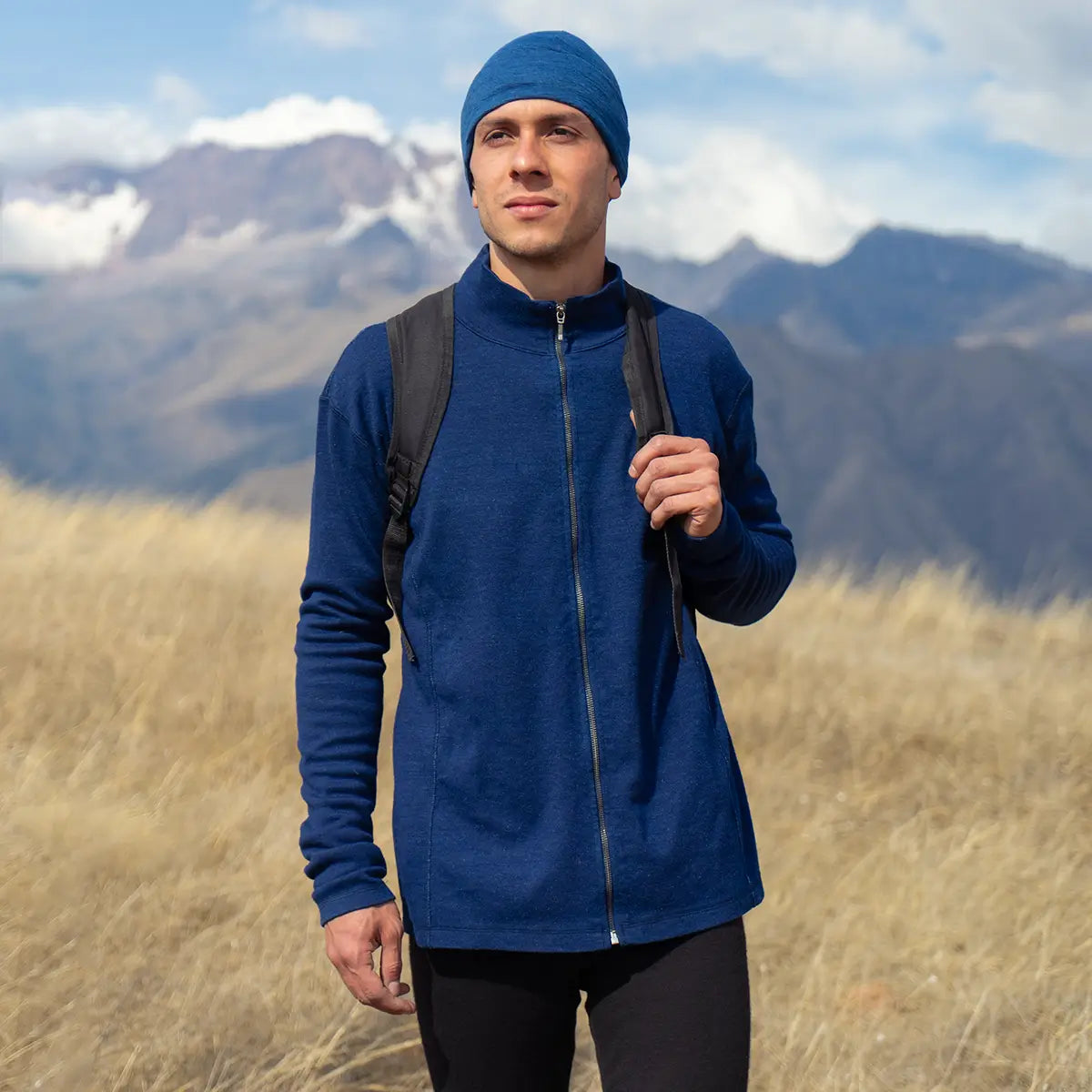 Man wearing alpaca wool mid layer on a hike in the mountains