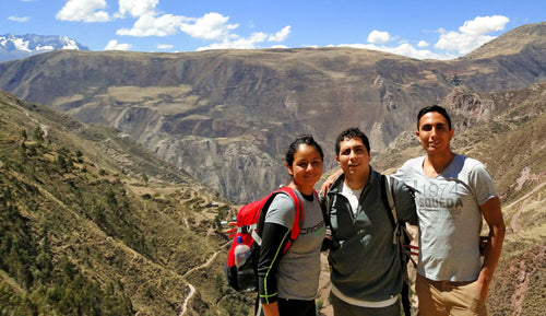 Meli and Rensso Hinostroza and brother on a hike in the mountains